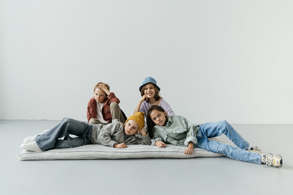 pexels photo 6261903 6261903 A group of fashionable children posing casually with modern attire, showcasing youthful style.